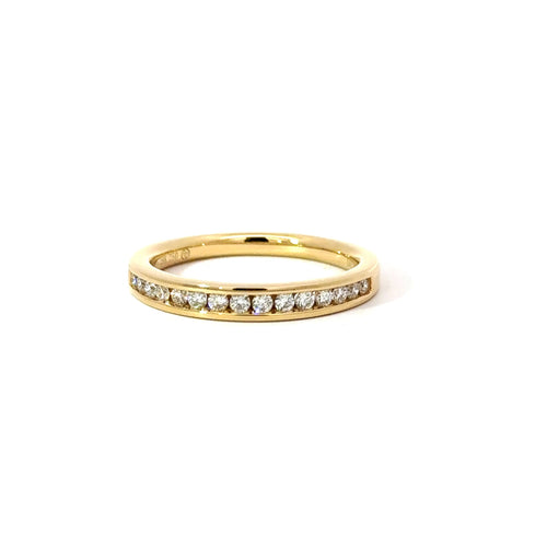 Yellow gold channel set diamond ring